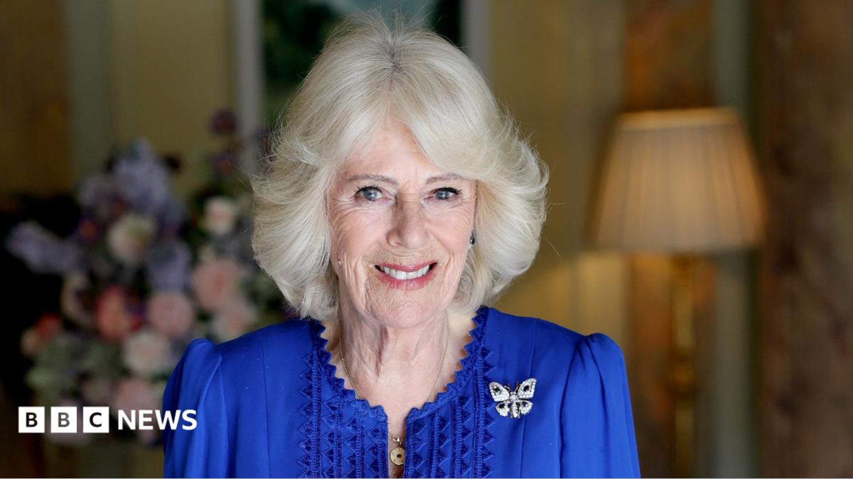 A picture of Queen Camilla in a blue dress