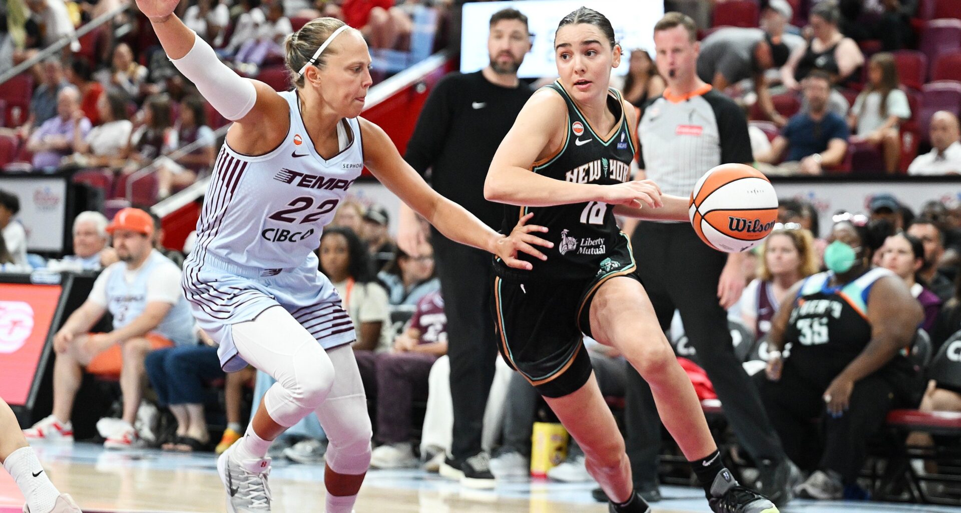 Toronto Tempo's Julie Allemand (22) defends against New York Liberty's Pauline Astier (18) during the second half of a WNBA basketball game in Montreal, on Sunday, July 12, 2026. (Graham Hughes/The Canadian Press via AP)