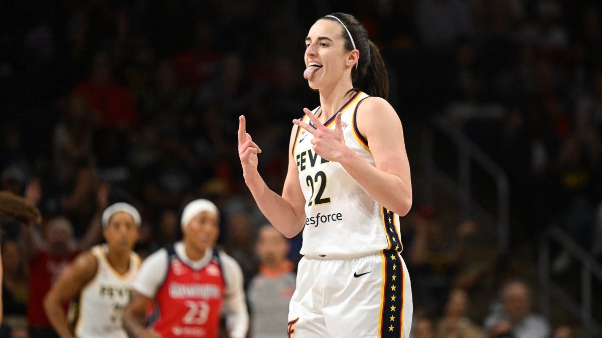 Indiana Fever All-Star Caitlin Clark celebrates banging a 3-pointer vs. the Washington Mystics.