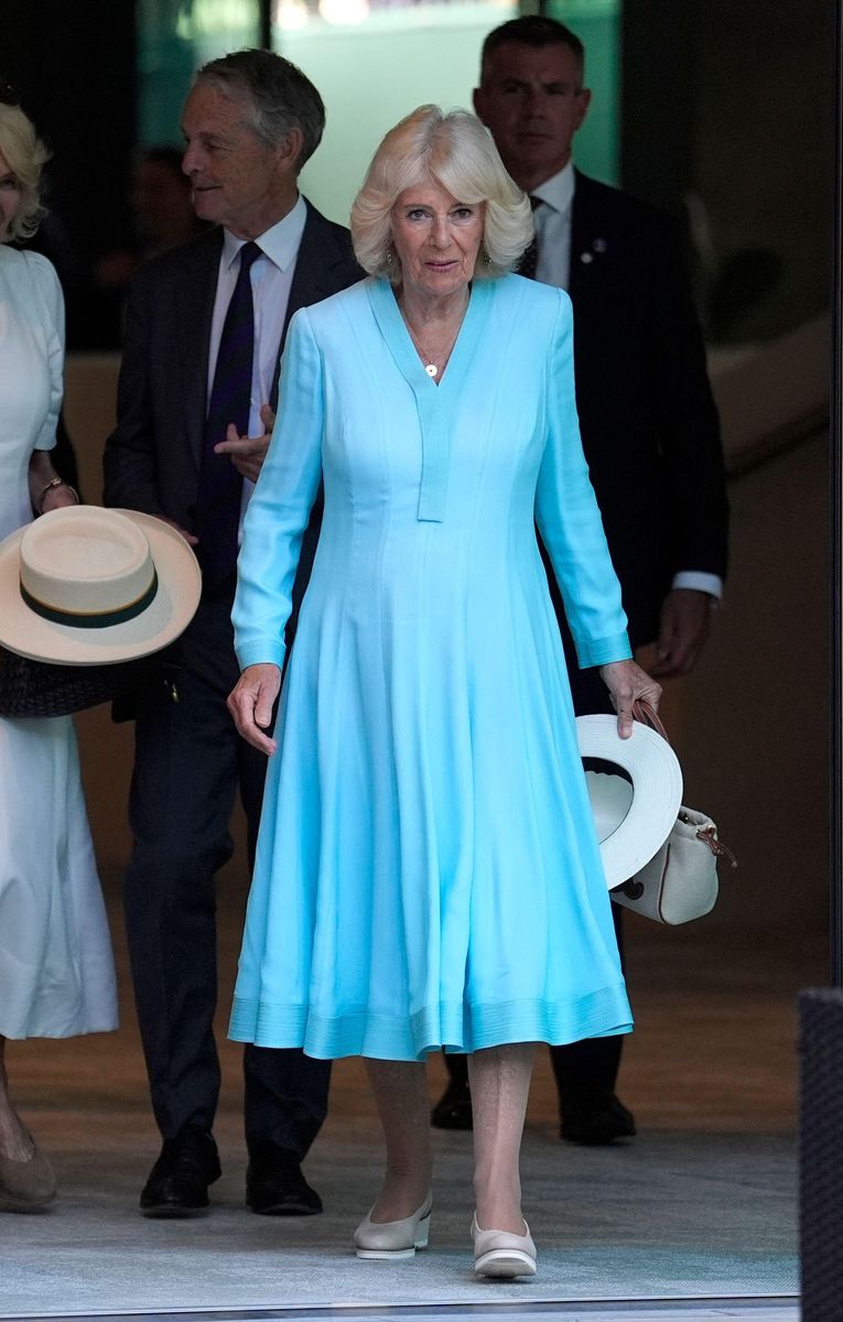 Queen Camilla arrived at Wimbledon wearing an elegant icy-blue Anna Valentine dress paired with her signature sentimental jewelry.