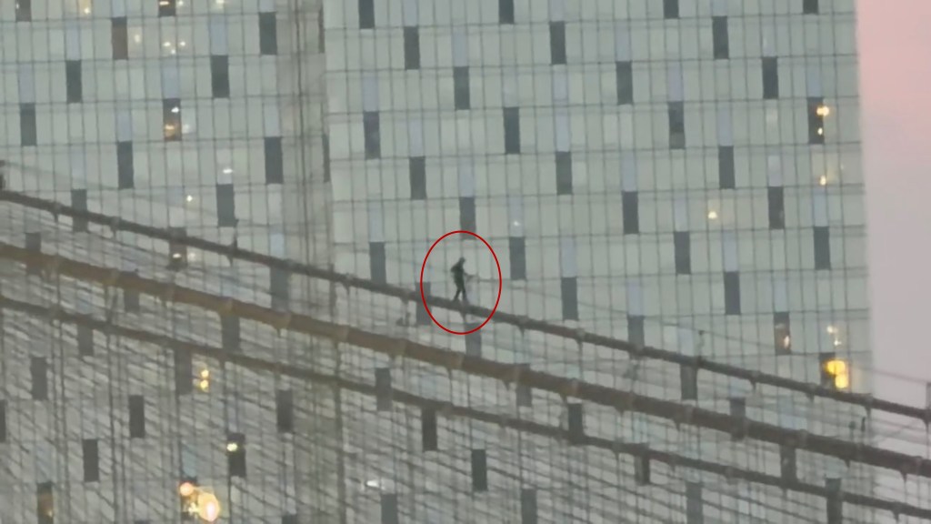 Terrifying video obtained by The Post captured a man walking across the Brooklyn Bridge's steel cables from a towering pillar Wednesday night.