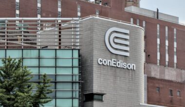 A conEdison building with modern architecture featuring glass and a prominent logo on the facade.