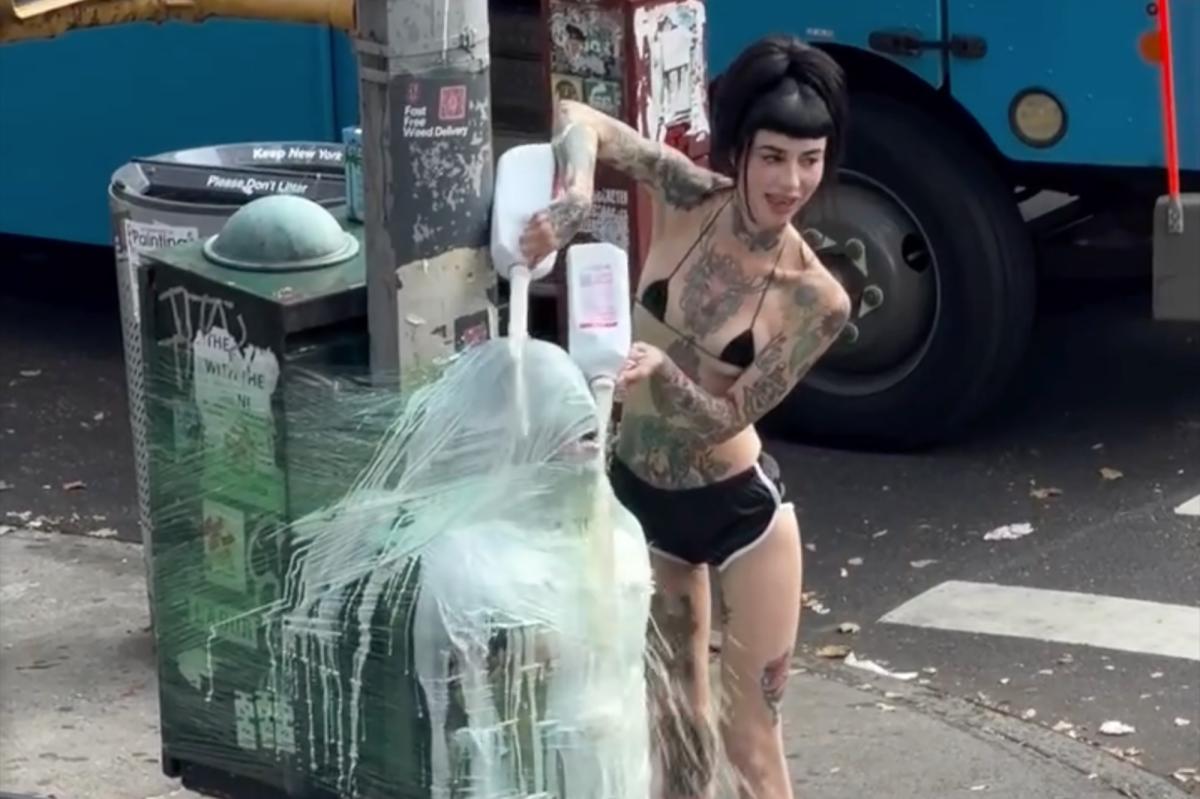NYC dominatrix plastic wraps sub to pole and douses him in milk