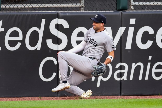 Yankees shortstop Max Schuemann (30) falls after missing a RBI triple from White Sox right fielder Braden Montgomery (24) during the first inning at Rate Field July 27, 2026 in Chicago. (Armando L. Sanchez/Chicago Tribune)