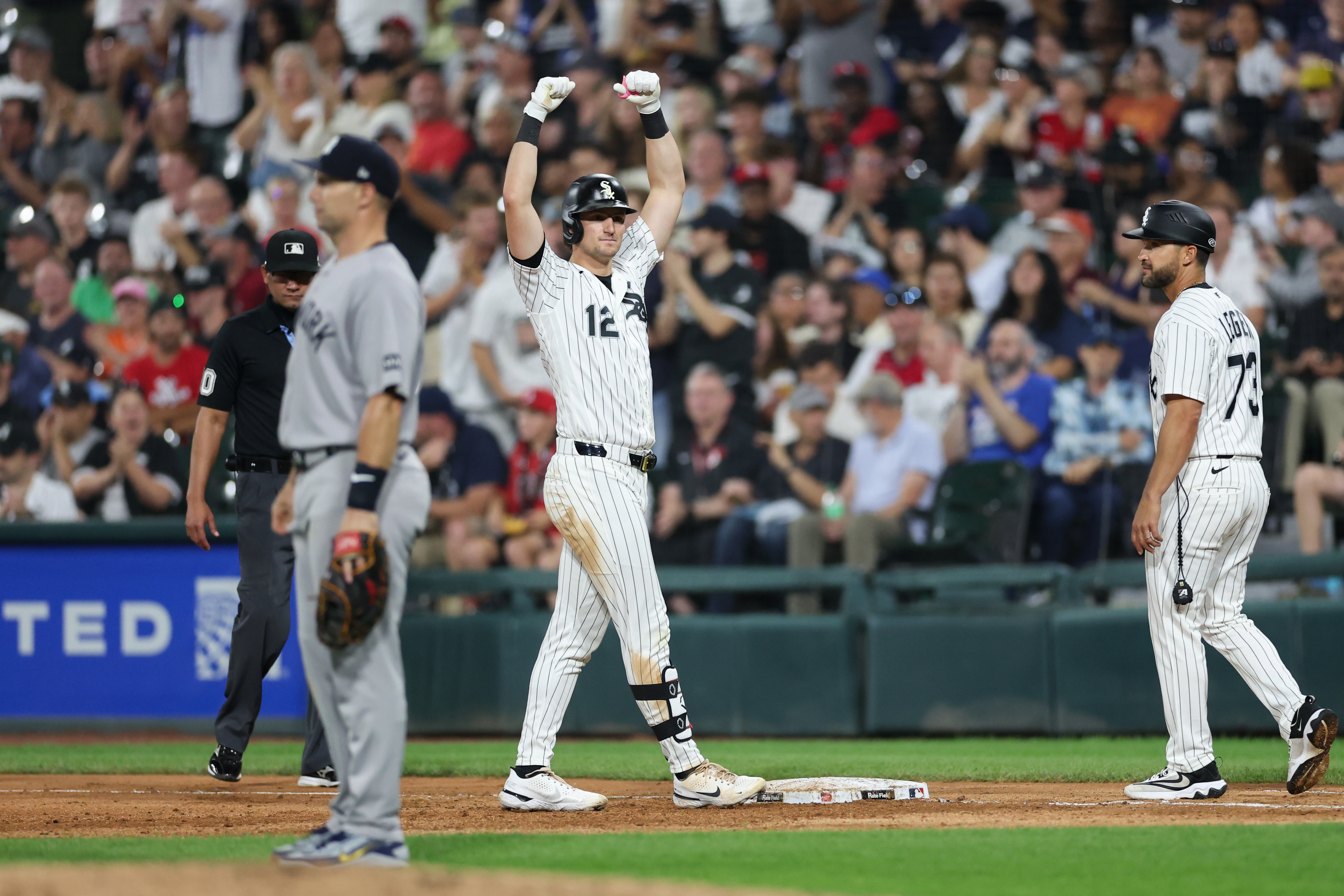 White Sox shortstop Colson Montgomery (12) flexes at first after hitting a RBI single during the fifth inning against the Yankees at Rate Field July 27, 2026 in Chicago. (Armando L. Sanchez/Chicago Tribune)