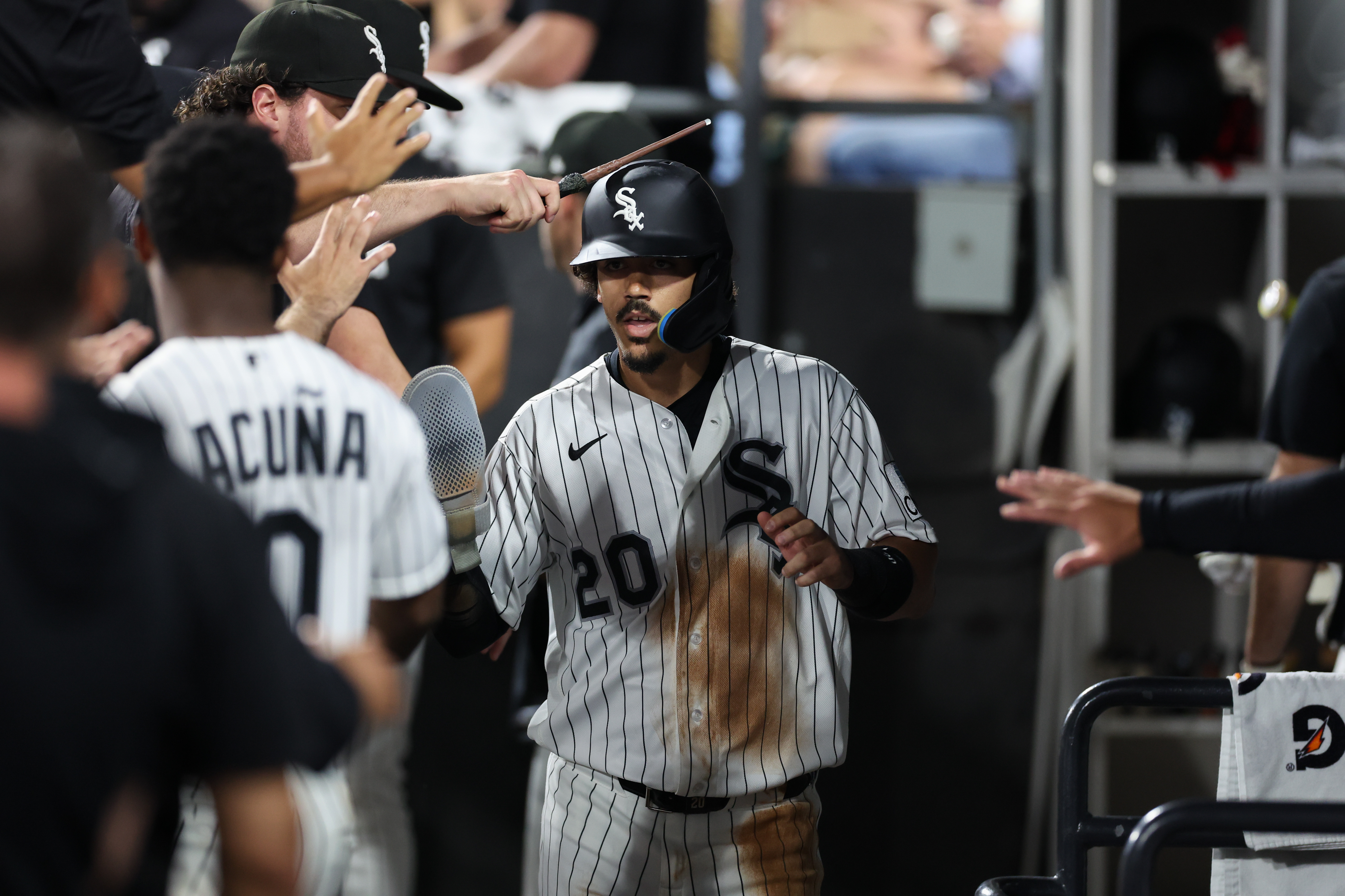 White Sox third baseman Miguel Vargas (20) celebrates in the dugout after scoring a run during the fifth inning against the Yankees at Rate Field July 27, 2026 in Chicago. (Armando L. Sanchez/Chicago Tribune)