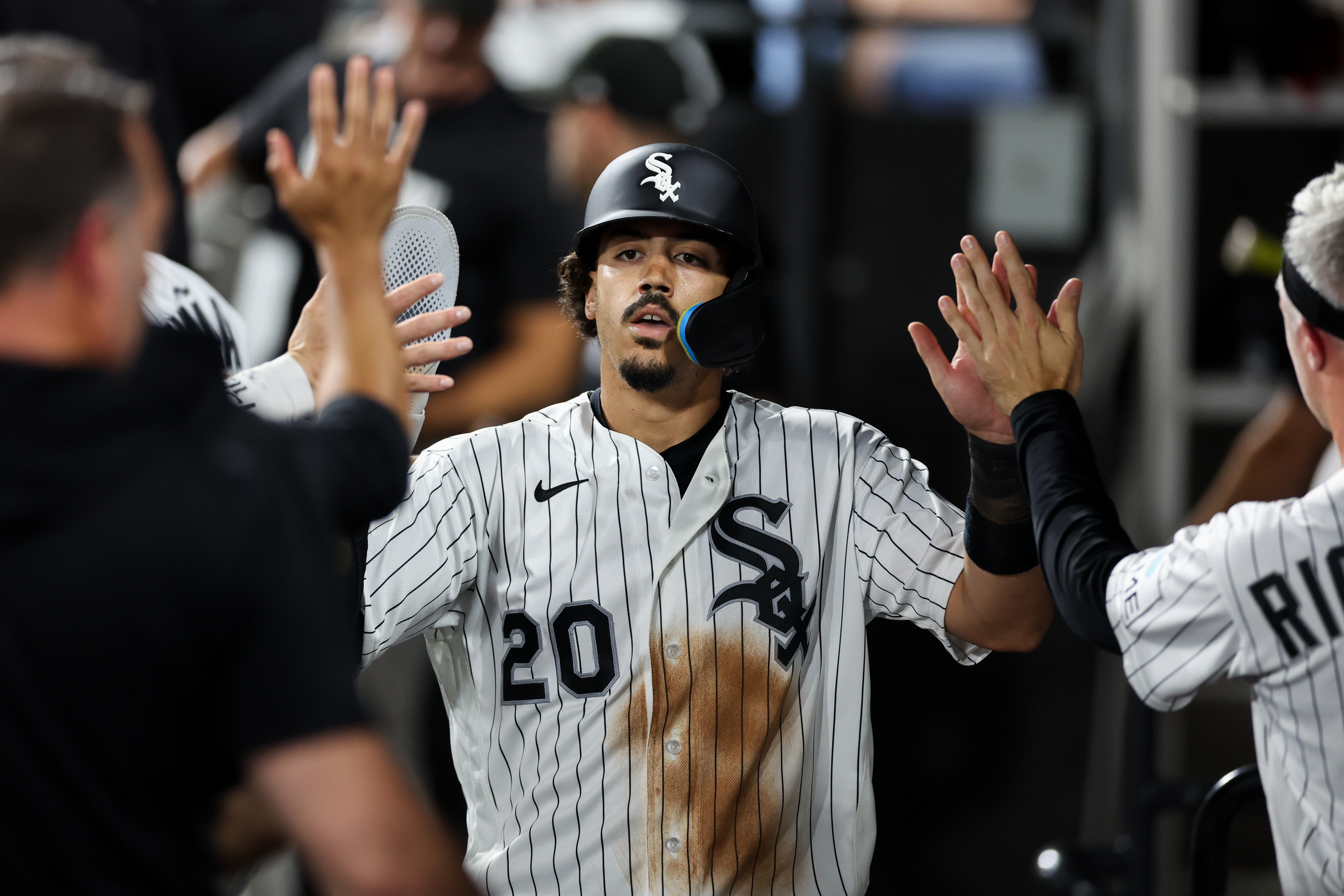 White Sox third baseman Miguel Vargas (20) celebrates in the dugout after scoring a run during the fifth inning against the Yankees at Rate Field July 27, 2026 in Chicago. (Armando L. Sanchez/Chicago Tribune)