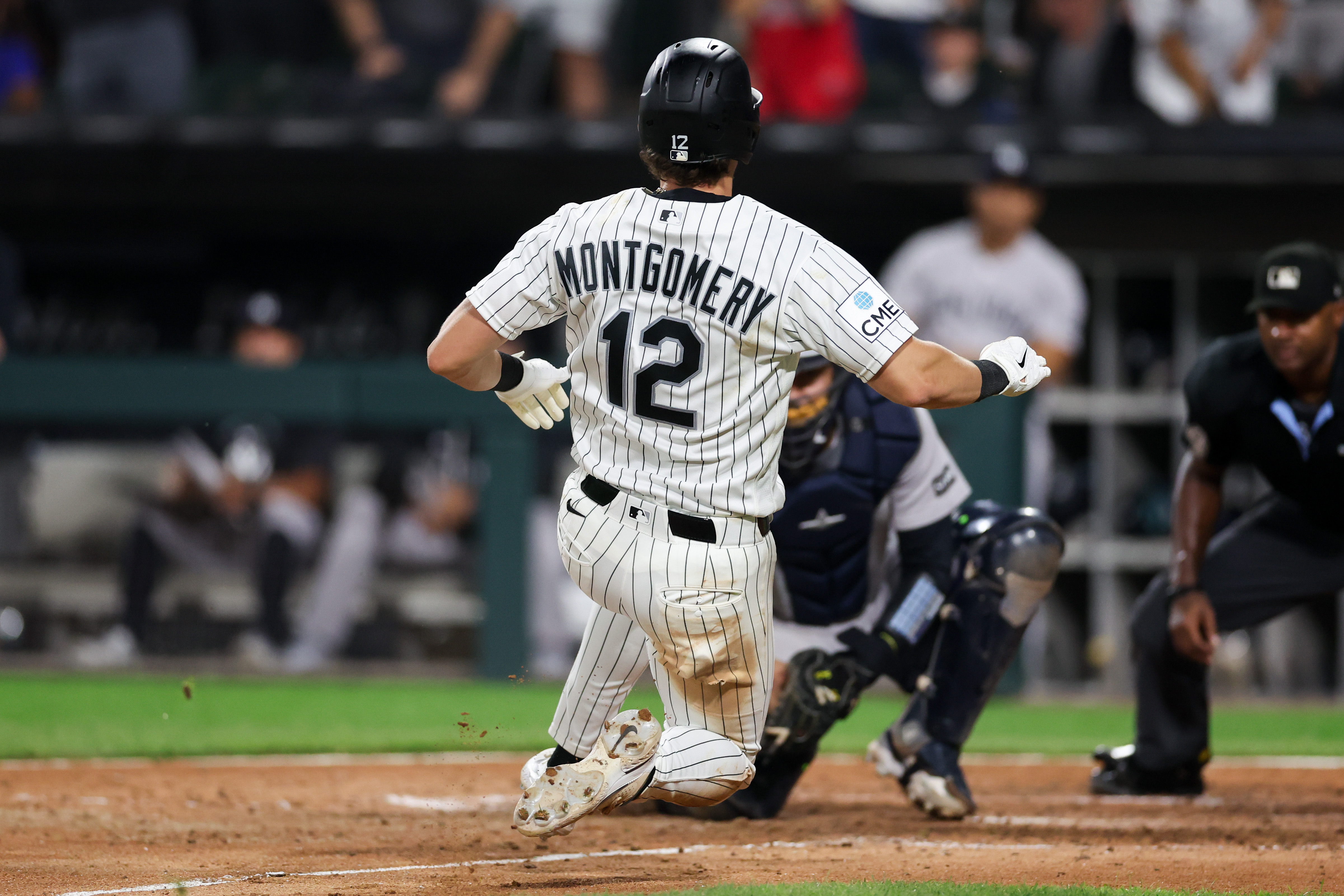 White Sox shortstop Colson Montgomery (12) gets tagged out by Yankees catcher Ali Sánchez (39) during the seventh inning at Rate Field July 27, 2026 in Chicago. (Armando L. Sanchez/Chicago Tribune)
