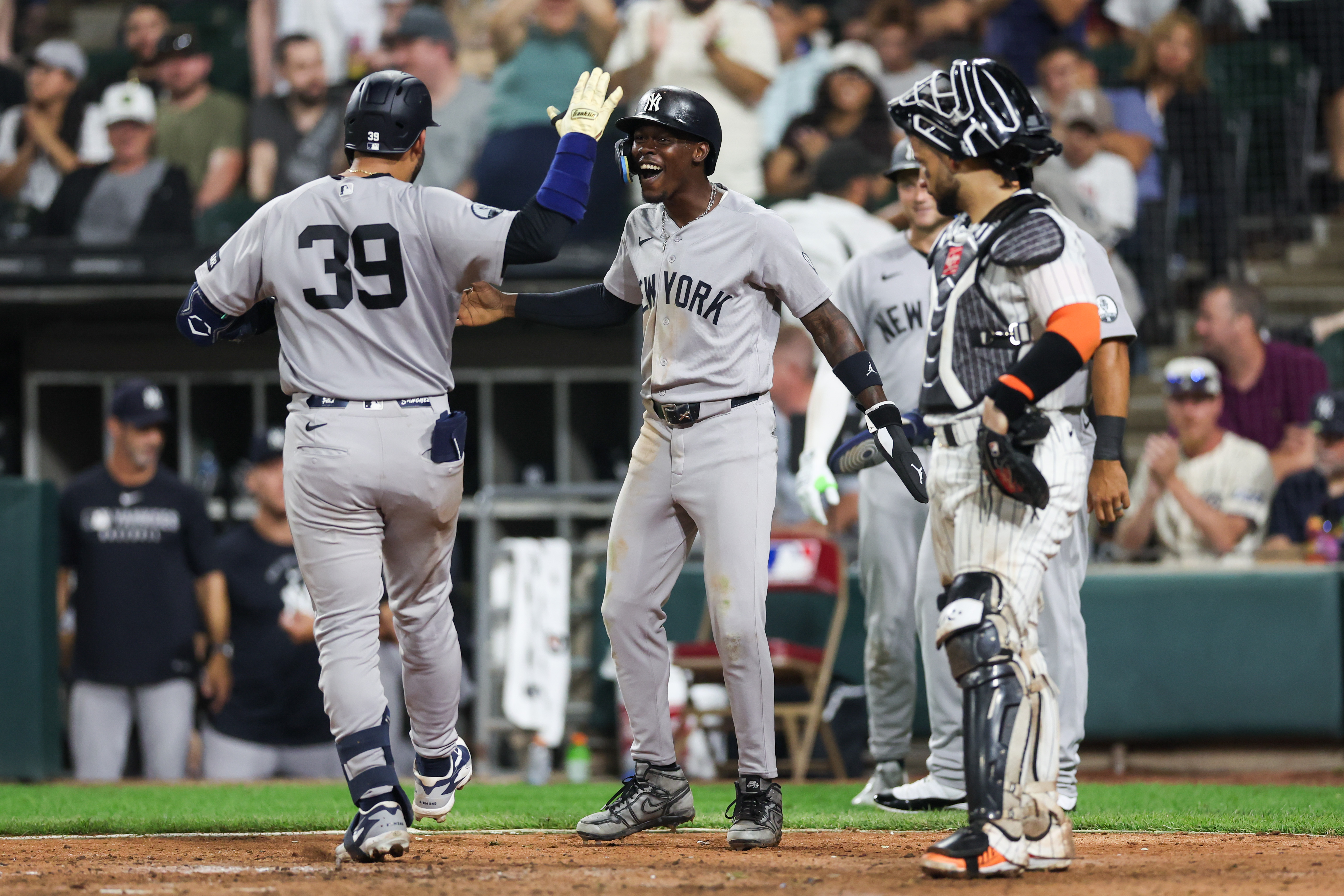 Yankees catcher Ali Sánchez (39) celebrates with Yankees second baseman Jazz Chisholm Jr. (13) after Sánchez hit a three-run homer during the eighth inning against the White Sox at Rate Field July 27, 2026 in Chicago. (Armando L. Sanchez/Chicago Tribune)