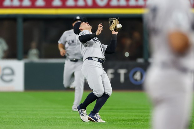 Yankees shortstop Anthony Volpe (11) drops a ball from White Sox shortstop Colson Montgomery (12) resulting in a RBI single during the ninth inning at Rate Field July 27, 2026 in Chicago. (Armando L. Sanchez/Chicago Tribune)