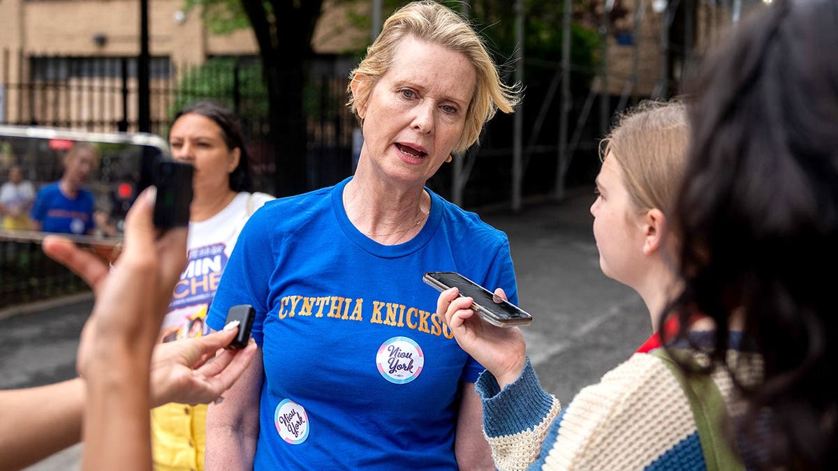 Cynthia Nixon speaks with reporters during New York primary election.