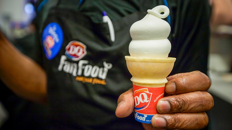 Dairy Queen worker holds ice cream cone