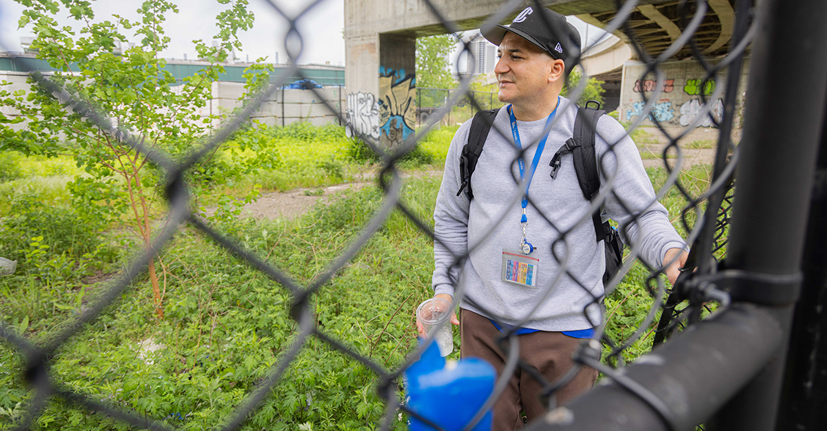 Jose looks off into the distance where a homeless encampment used to be, optimistic that the individuals he connected to services and offered resources to in the past, were alive and safe. The encampment was recently cleared for reasons unknown.