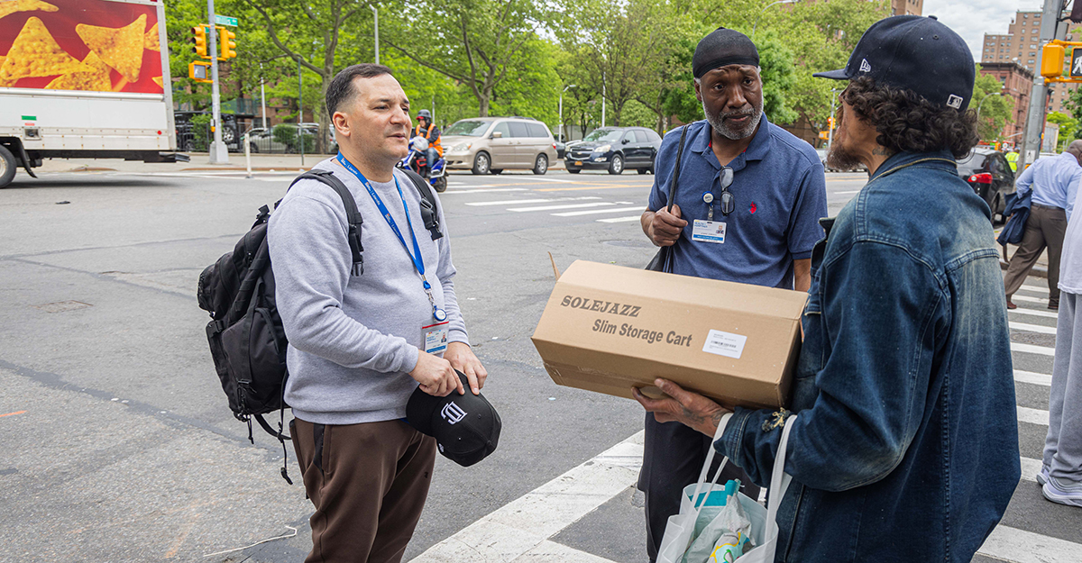 Andre and Jose happen across someone they’ve provided services to before. In this photo, they learn that the individual just lost his apartment and was getting mentally prepared to be homeless again. Jose assures the individual he can connect him to shelter services in less than two hours—but they are hesitant.