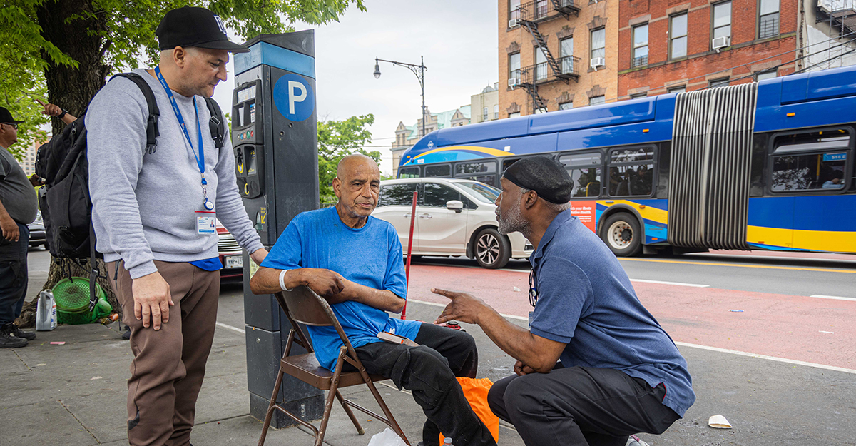 A success story: Luis (seated in blue t-shirt) who has struggled with opioid use for a while, has been following buprenorphine treatment and abstaining from opioids, is happy to update Jose and Andre about his progress. Luis was also suffering from knee impediments and recently received surgery at Lincoln Hospital. (1/2)