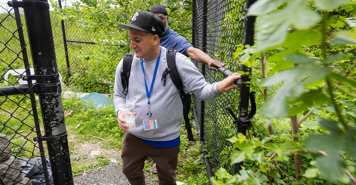 While many care providers work in traditional spaces like hospitals, clinics, nursing homes and residential settings, Jose and Andre tread paths that many of us would never dare take. Here, they make their way to a homeless encampment adjacent to the 138th Street bridge for a wellness check. (1/4)