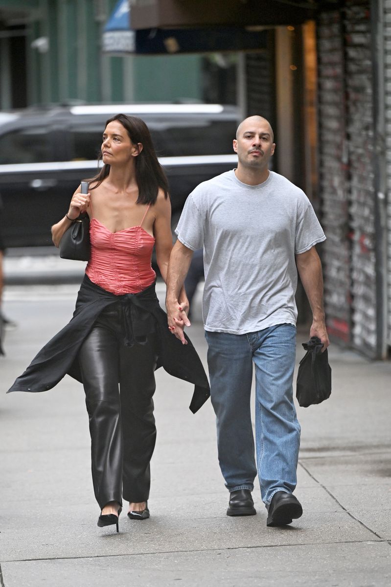 Katie Holmes embraced her signature effortless style in a coral satin camisole, black leather pants and classic pointed-toe heels for the couple's date night.