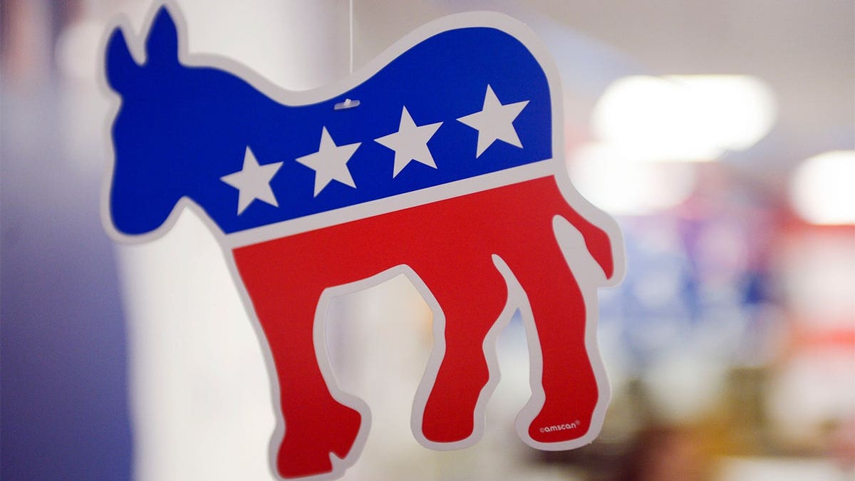 A paper donkey hanging from the ceiling inside a campaign field office.