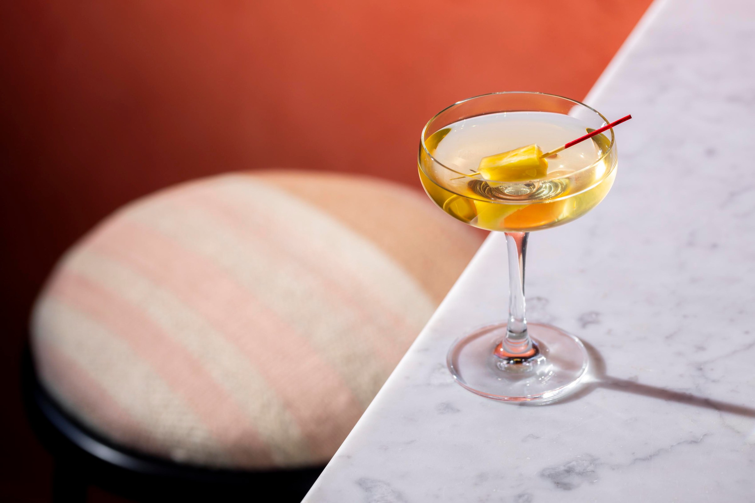 A martini cocktail on a table.
