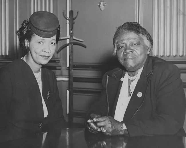 Dorothy Height (Left) sits next to Mary McLeod Bethune (Right), her longtime ally in the civil rights and women's rights movement and partner in the National Council of Negro Women.