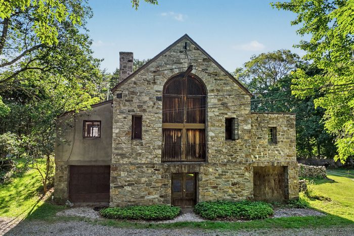 The back of the house today. The central door leads to the basement level.