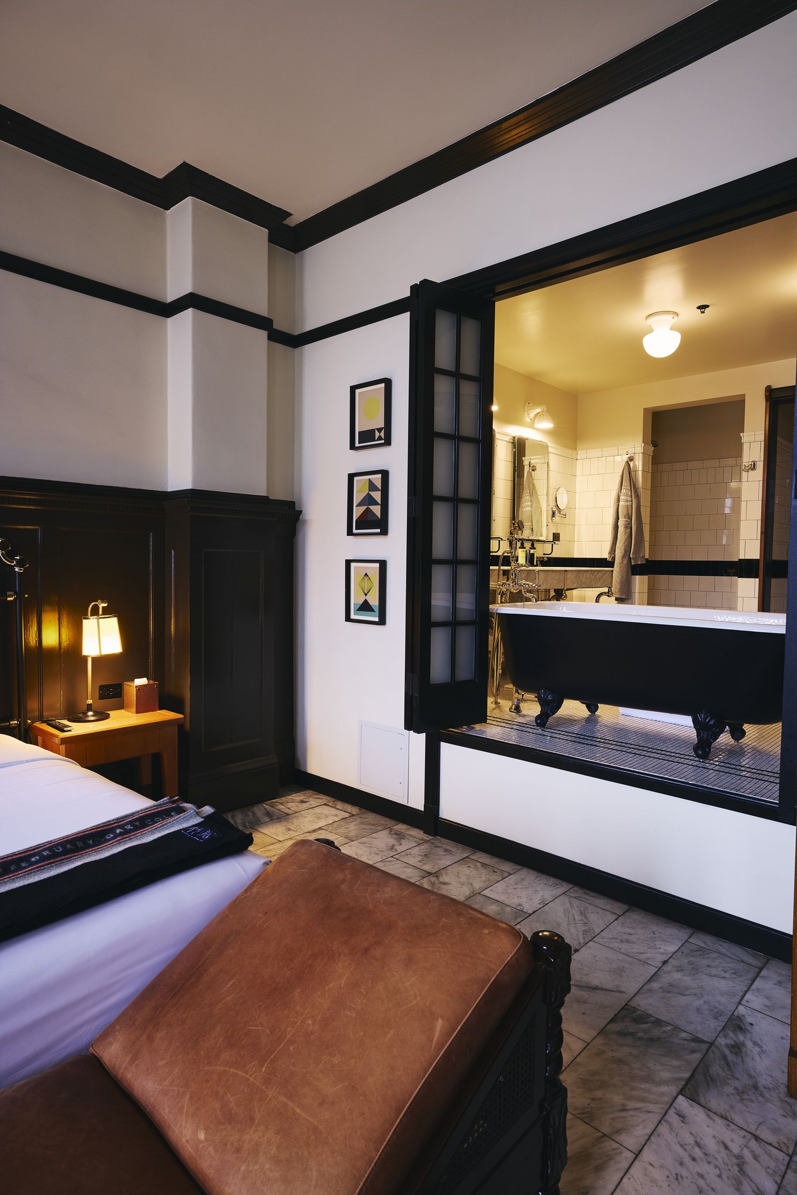 Image may contain Indoors Interior Design Furniture Bed Bedroom Room Architecture Building and Hotel