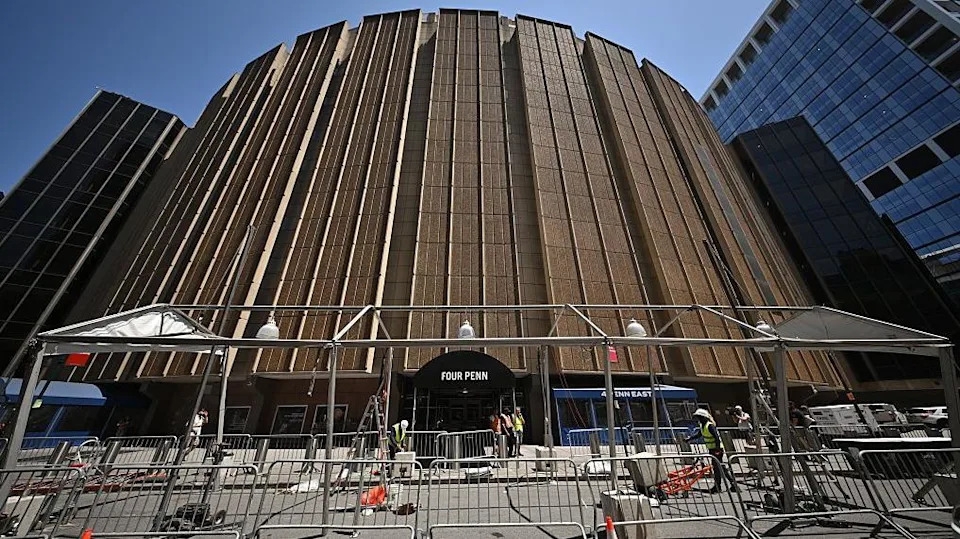 Workers put up a tent frame outside Madison Square Garden.
