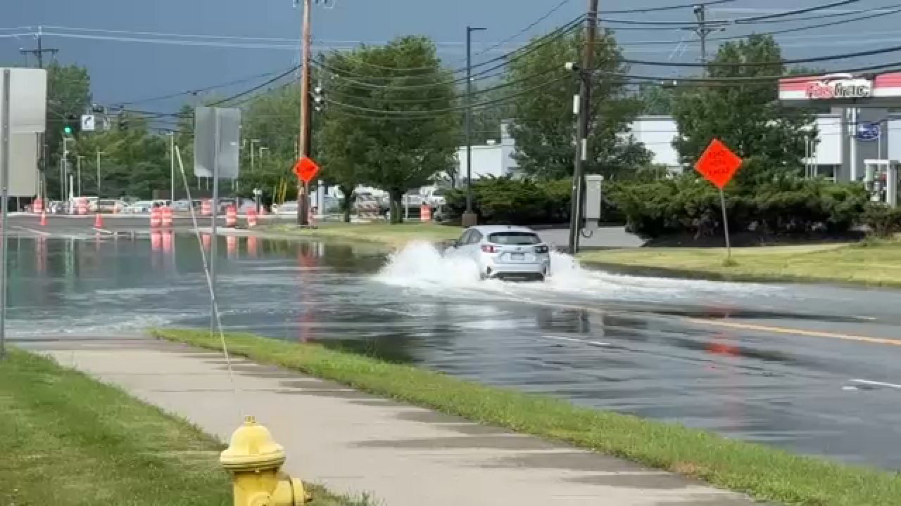A car driving through a flooded road