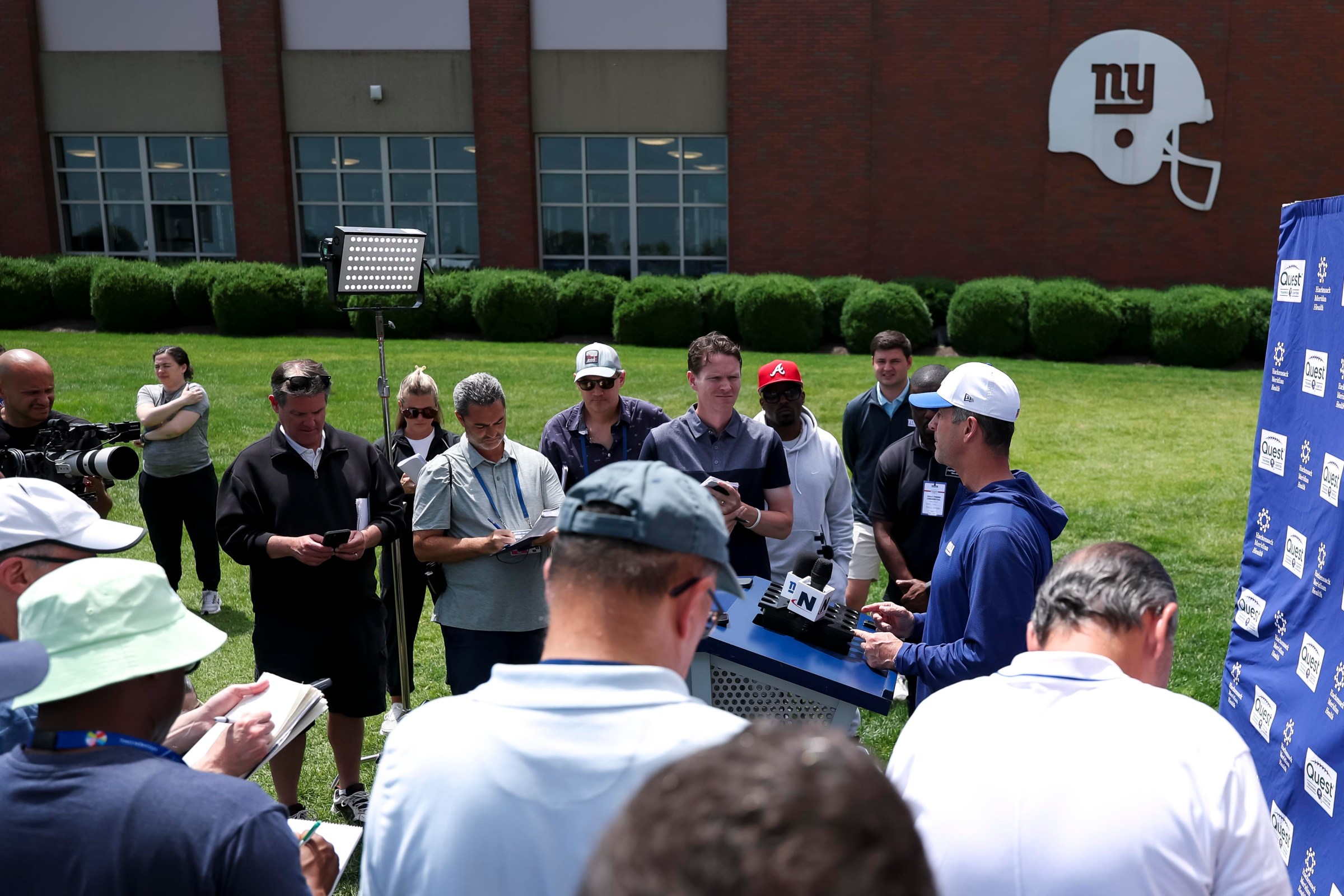 John Harbaugh speaks to media.