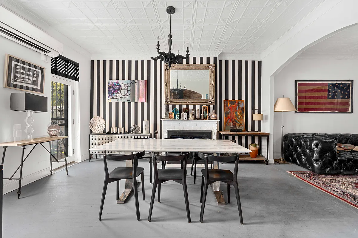 dining area with tin ceiling, black and white striped wallpaper