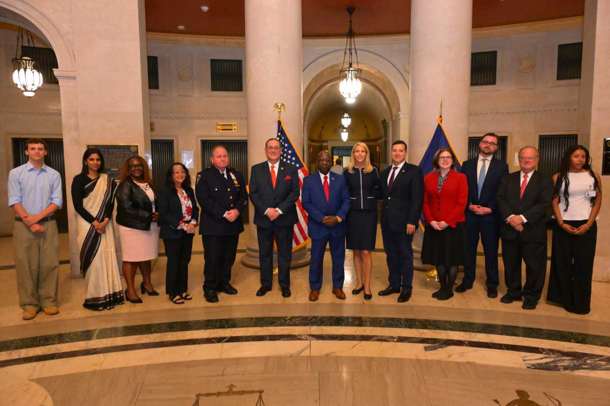 At the heart of Thursday's ceremony was a formal reading of the Declaration alongside remarks from members of the New York State court system. Hon. Suzanne Adams, Administrative Judge, delivered opening remarks and an introductory statement, while Hon. Milton Tingling, New York County Clerk, led a guided reflection. Ceremonial components included the Pledge of Allegiance, led by Captain Melissa Figueroa, and the national anthem performed by Special Referee Diego Santiago.