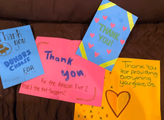 Thank you notes from students, in crayon on construction paper.
