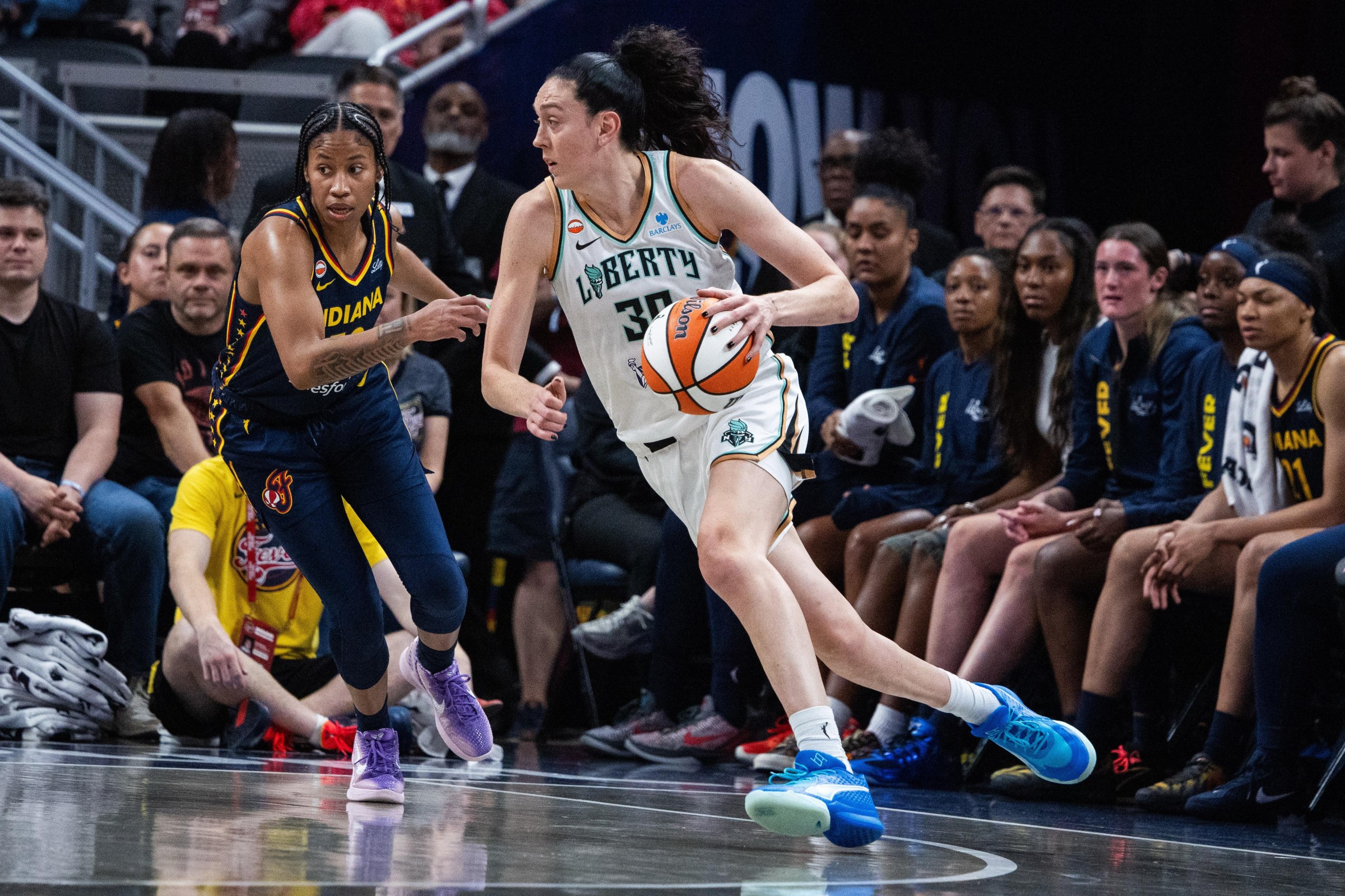 Jul 18, 2026; Indianapolis, Indiana, USA; New York Liberty forward Breanna Stewart (30) dribbles the ball while Indiana Fever guard Tyasha Harris (52) defends in the first half at Gainbridge Fieldhouse. Mandatory Credit: Trevor Ruszkowski-Imagn Images