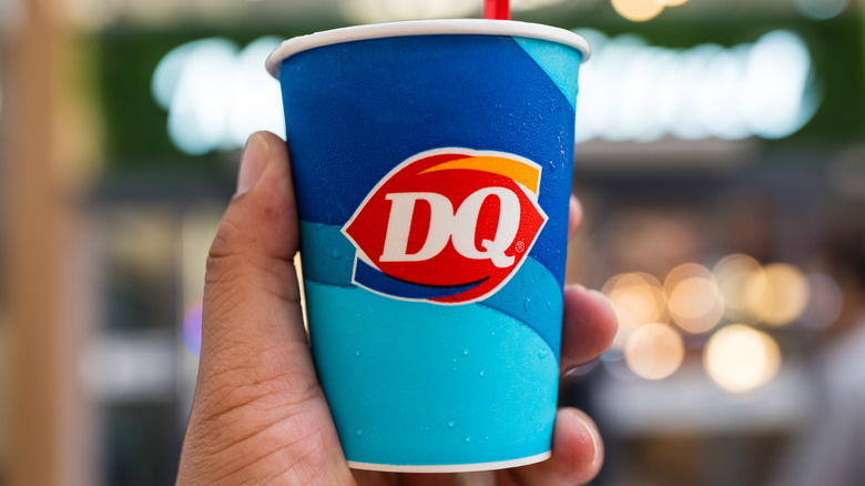 Hand holding Dairy Queen Blizzard cup