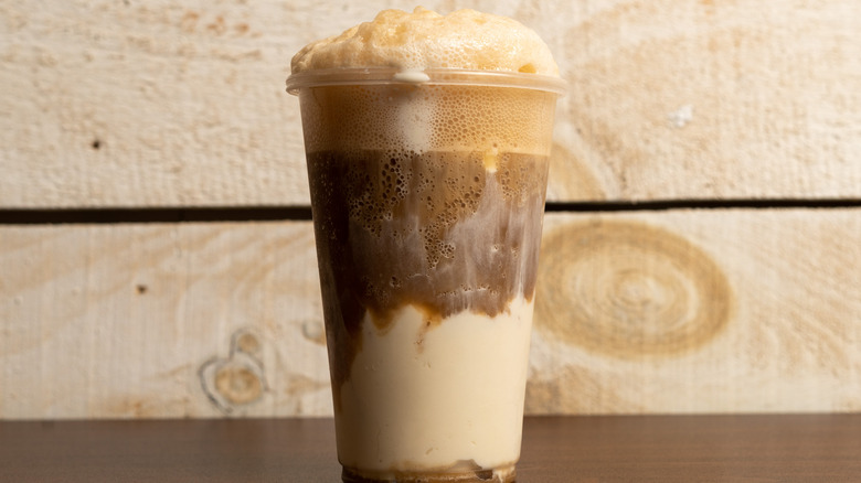 Chocolate ice cream float on a wooden surface
