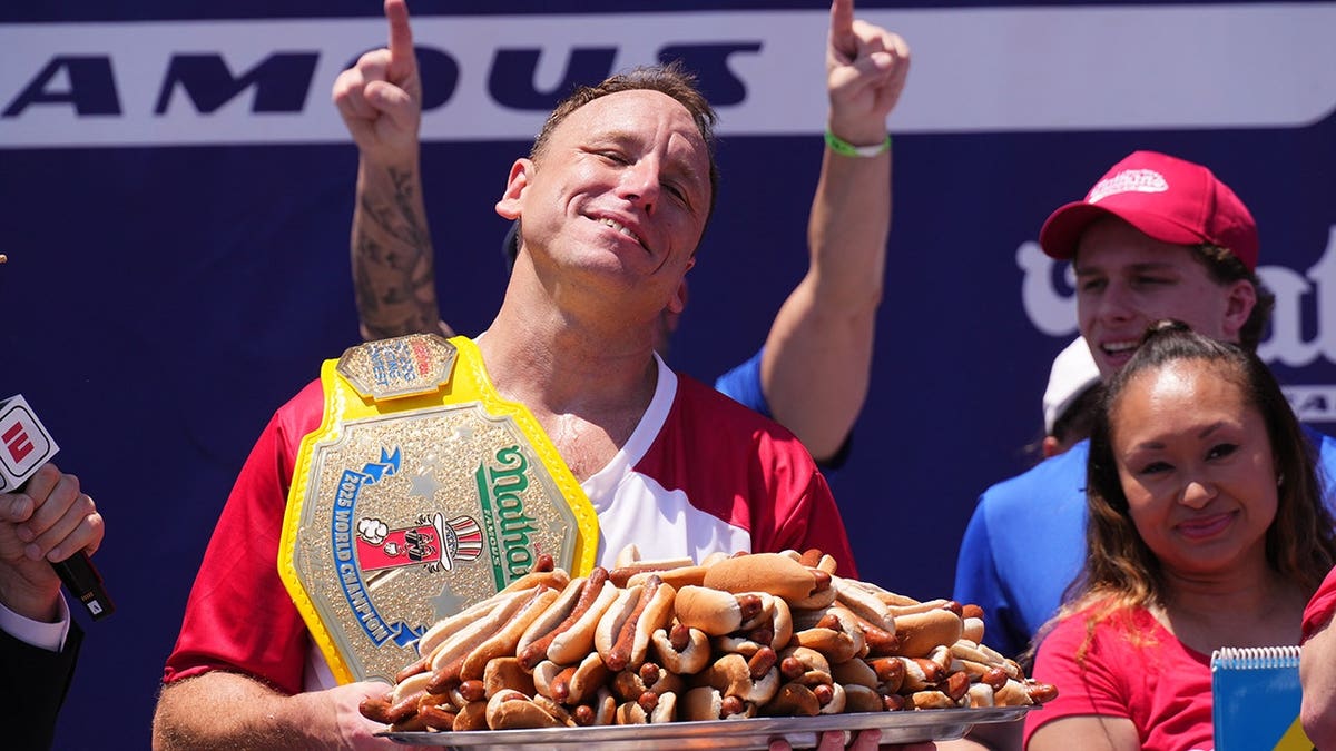 Joey Chestnut eating hot dogs at Nathan's Hot Dog Eating Contest in New York City