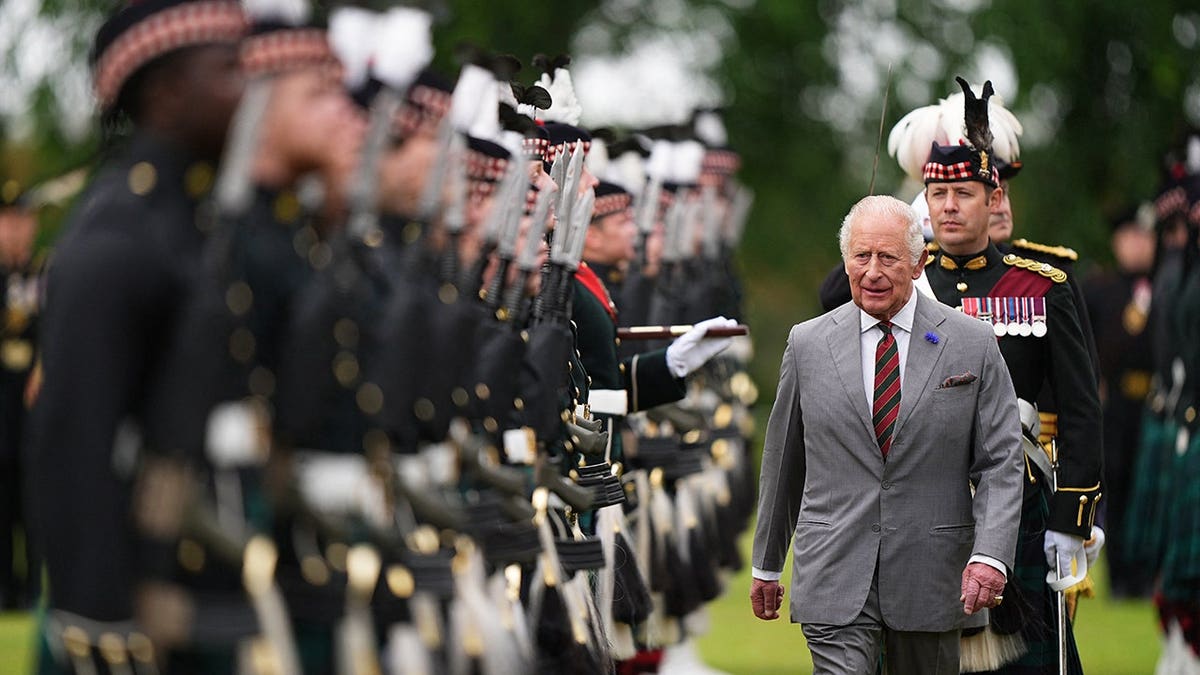 King Charles III inspects guard of honour in the Gardens of the Palace of Holyroodhouse in Edinburgh