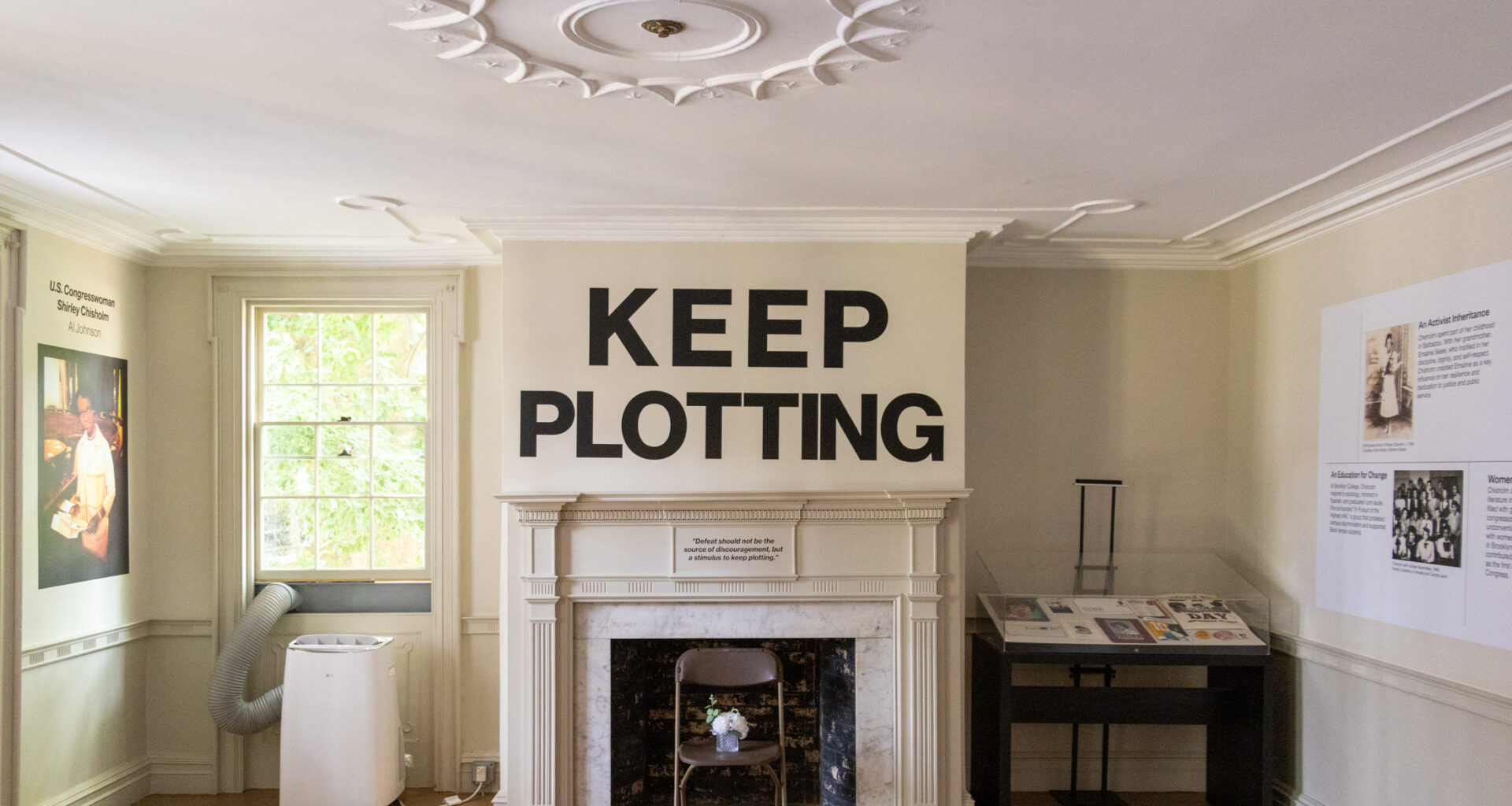 parlor with a mantel with the words