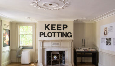 parlor with a mantel with the words