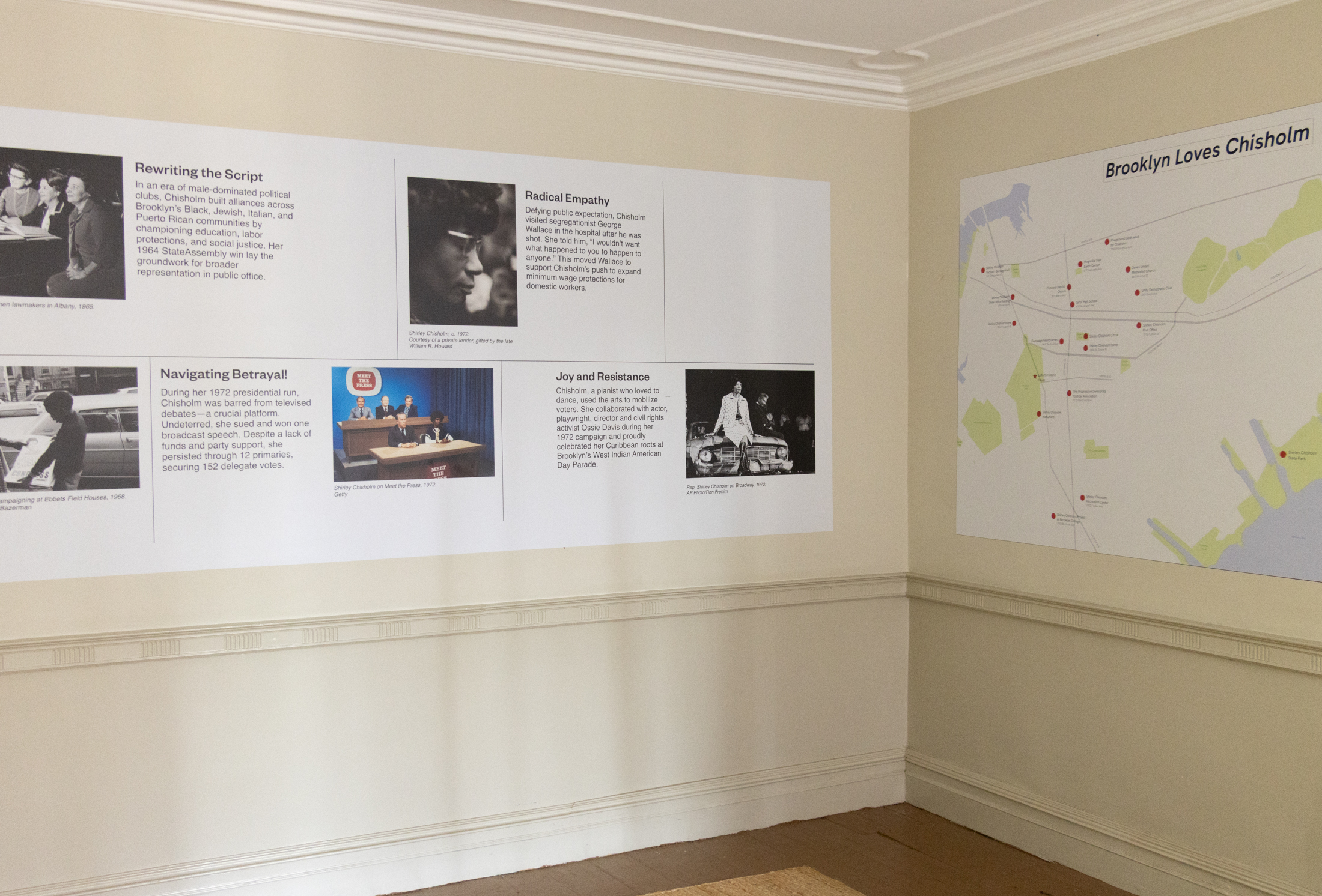 wall panels with photos of shirley chisholm and a map