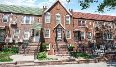 brick row house with front gable