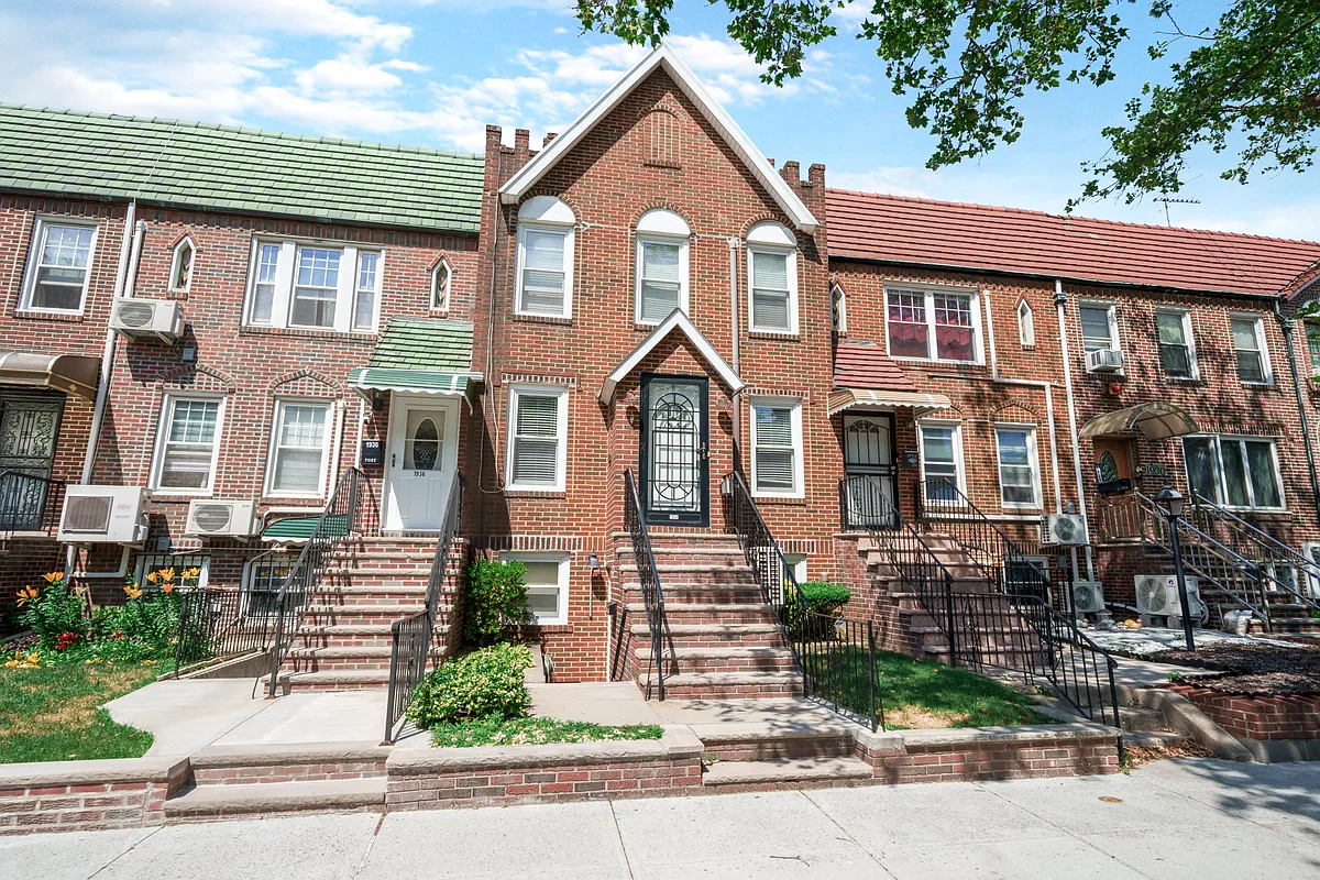 brick row house with front gable