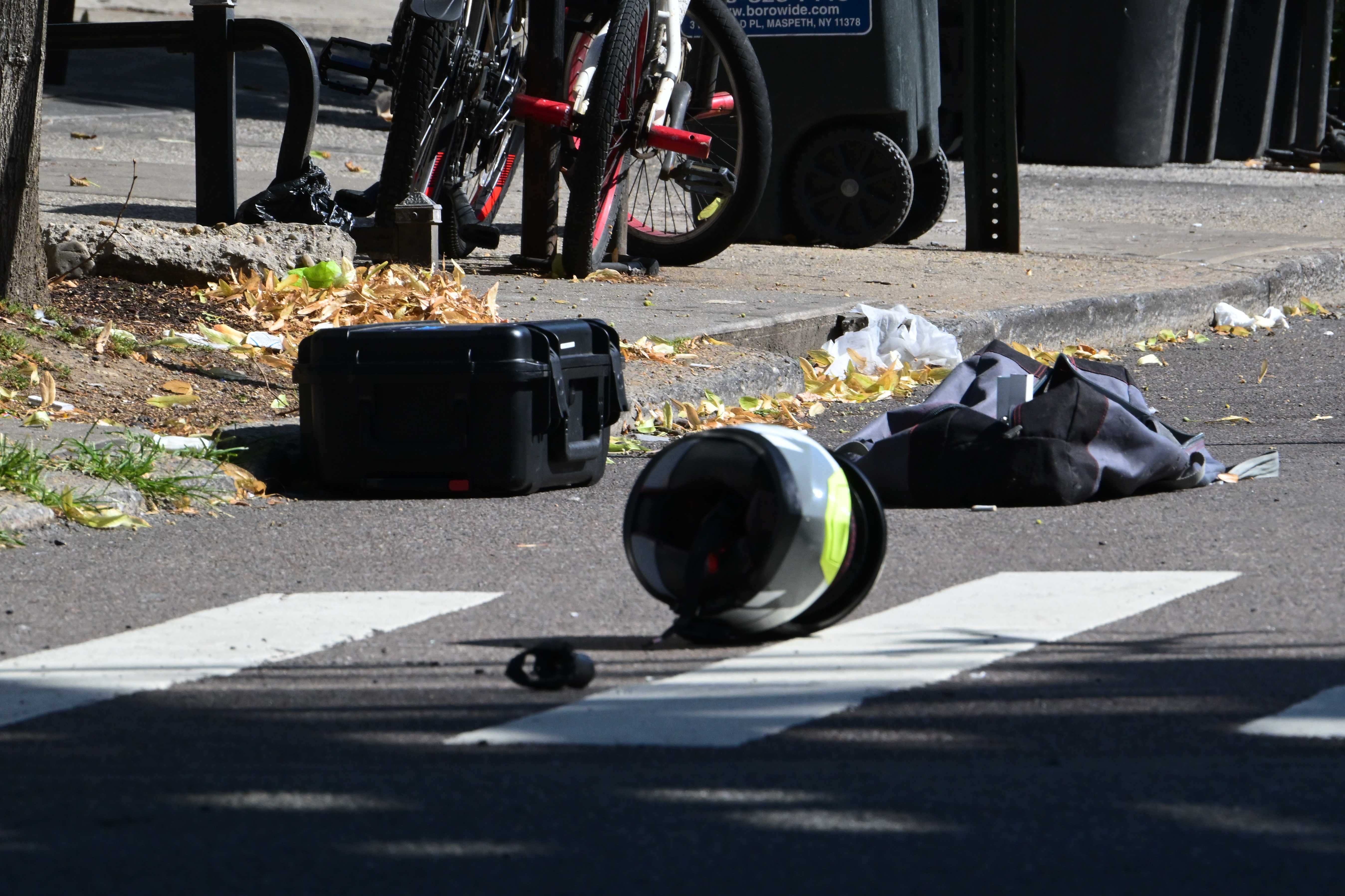The victims motorcycle ended on the sidewalk on Roosevelt Avenue and 64th Street where his helmet was found in the crosswalk. 
