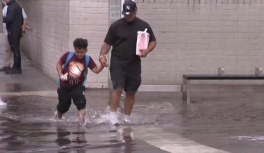 New Yorkers wade through ankle-deep water during flash flood in Brooklyn