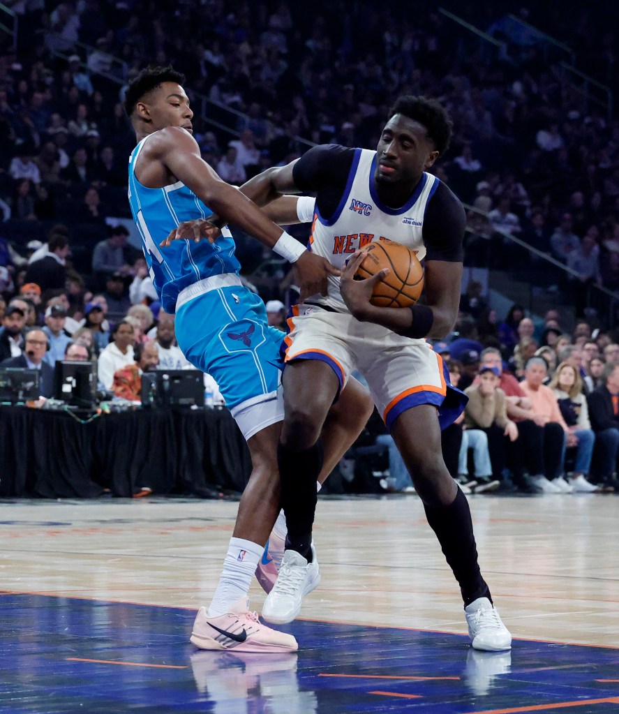 New York Knicks forward Mohamed Diawara drives to the basket as Charlotte Hornets forward Brandon Miller defends.