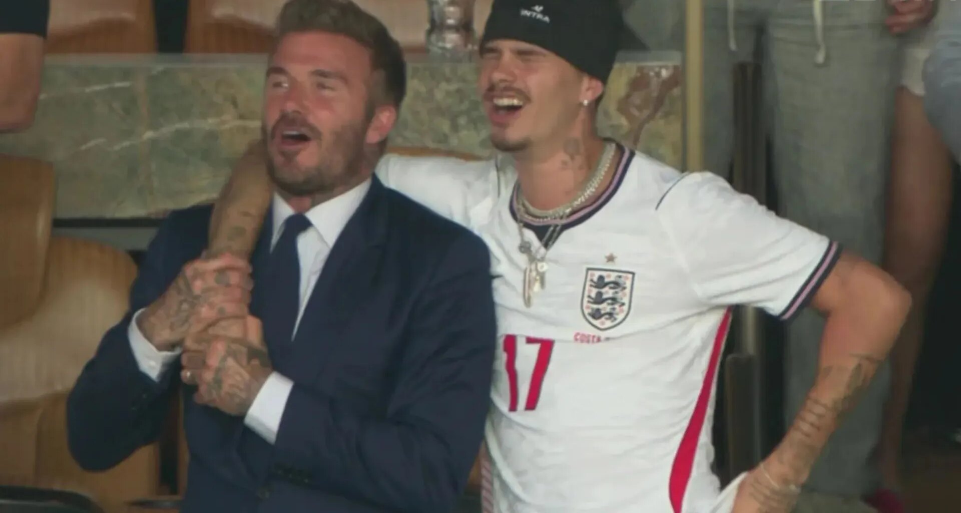 David Beckham belts out Wonderwall arm-in-arm with Romeo after England quarter-final win