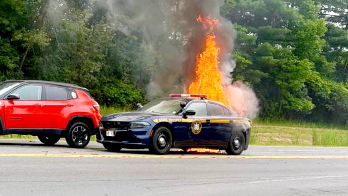 flames engulfing patrol vehicle