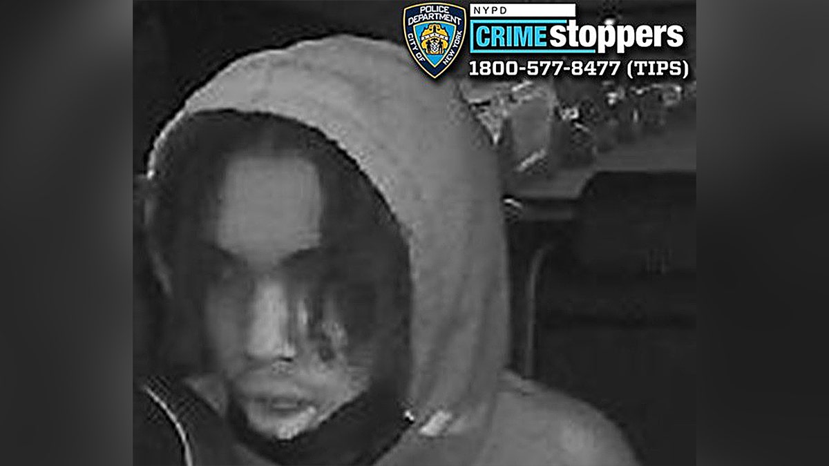 Hooded suspect inside car