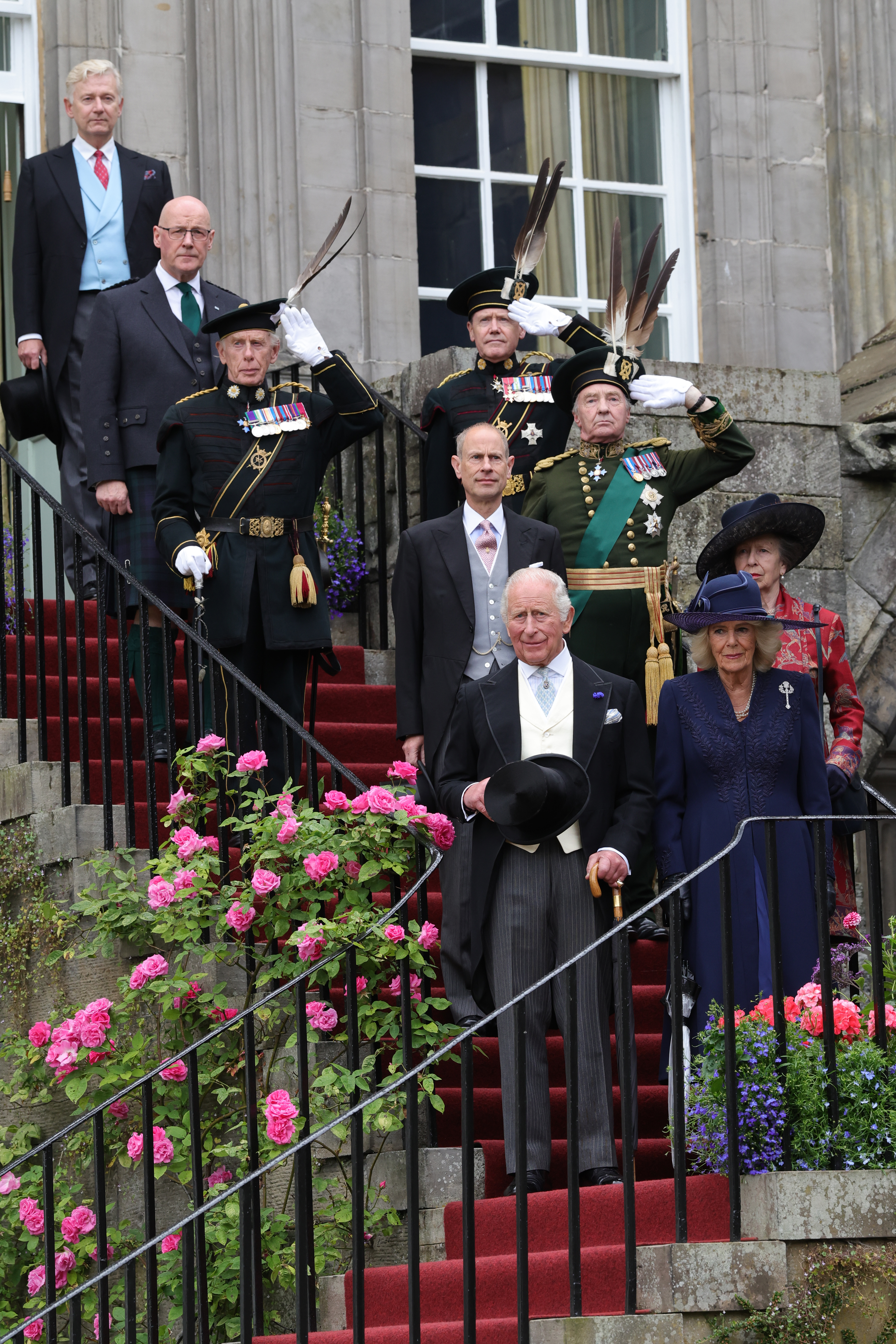 King Charles, Queen Camilla posing on the stairs of the Palace of Holyroodhouse