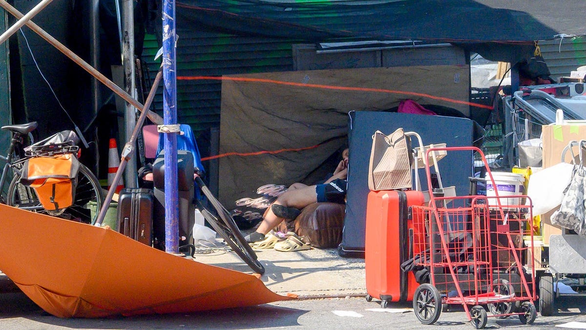 A woman sleeping at the homeless encampments